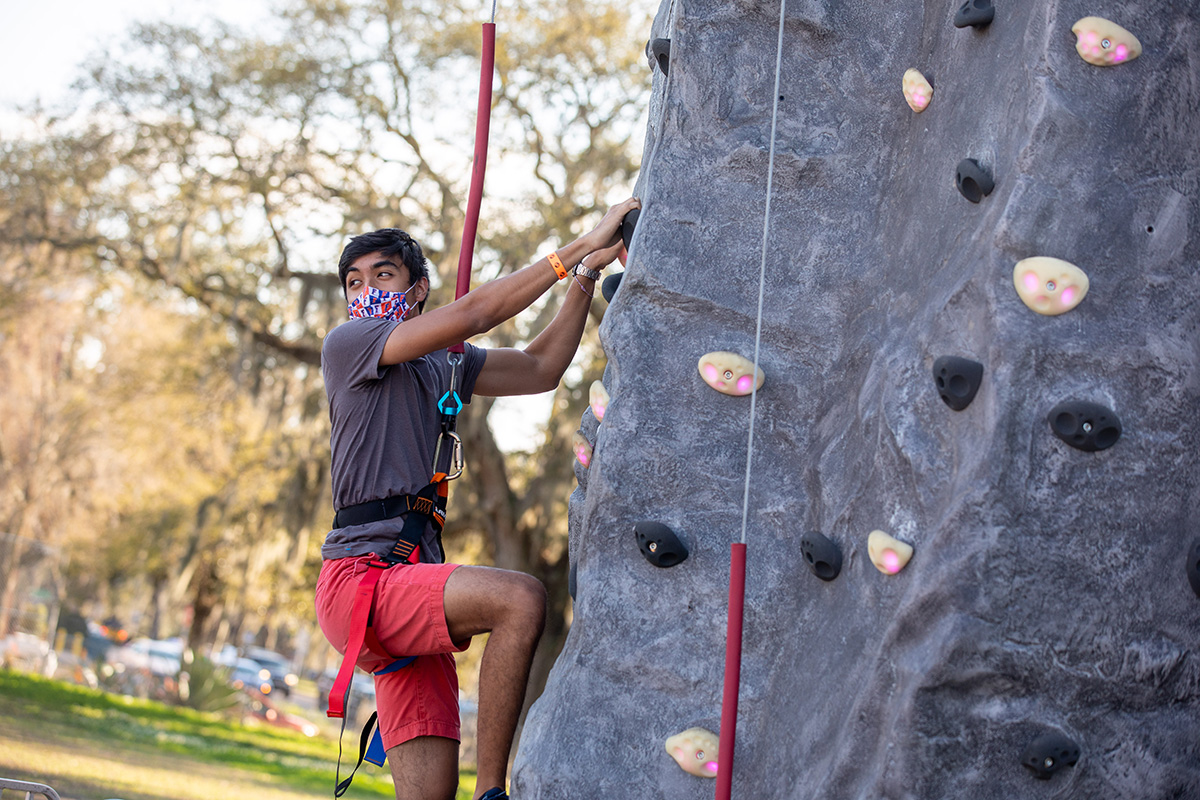 A student on a rock wall